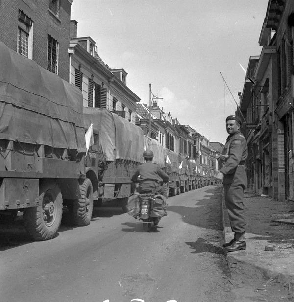 Canadian Trucks loaded with food head to Lowlands in order to help with the famine people. Source: Library and Files in Canada